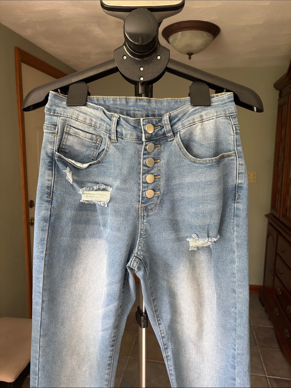 Women’s High-Rise Light Blue Distressed Button-Fly Jeans